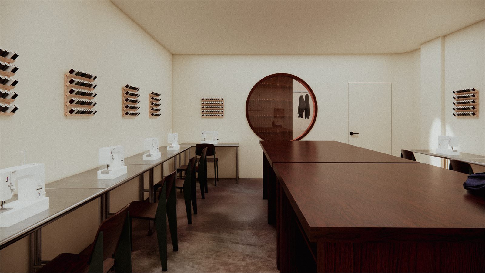 The cutting table from the far end, curved timber volume closing the room