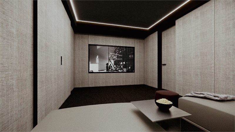 The cinema screen wall in pale acoustic panel with a cove-lit ceiling