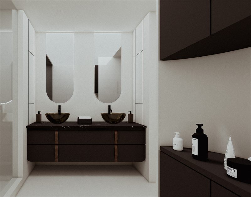 Double vanity with two arched mirrors and dark stone counters